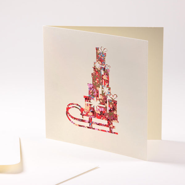 Grusskarte  "Schlitten mit Geschenken"